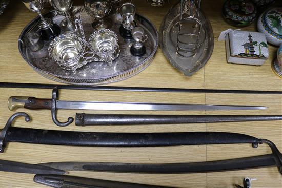 Three late 19th century French bayonets, a US Army bayonet, an EFD 1892 bayonet and an epee